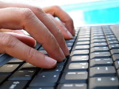 Fingers Typing on Keyboard