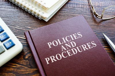 Policies and Procedures Book on Desk