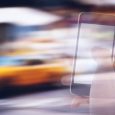 Smartphone Against Blurred Yellow Taxis