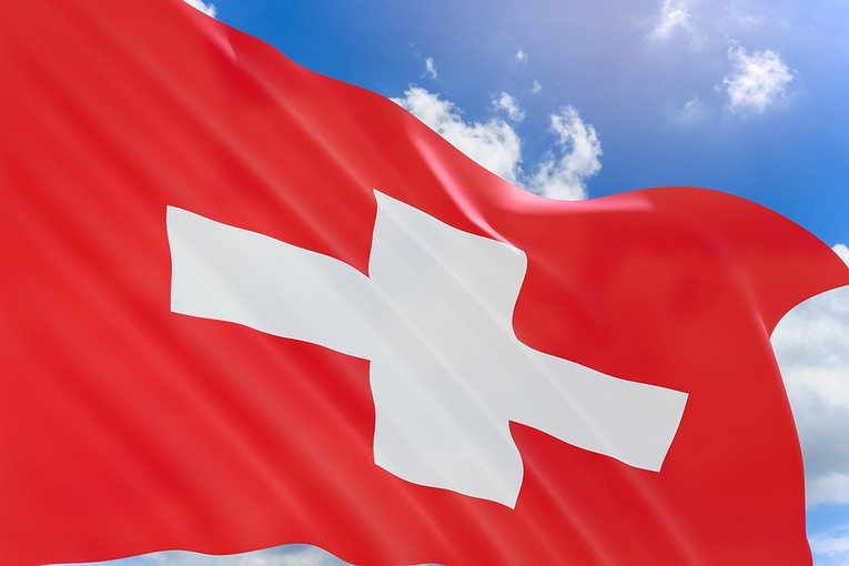 Swiss Flag Against Blue Sky