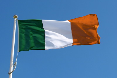 Irish Flag Against Clear Blue Sky