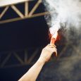 Hand of Man Holding Flare in a Stadium